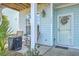 Cozy front porch with rocking chairs and a decorative wreath on the front door at 1717 Brittlebush Ln, Johns Island, SC 29455