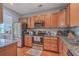 Well-equipped kitchen with stainless steel appliances, granite countertops, and light wood cabinets at 1717 Brittlebush Ln, Johns Island, SC 29455