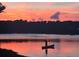 Scenic view of a person canoeing on the lake at sunset at 1717 Brittlebush Ln, Johns Island, SC 29455