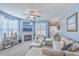 Comfortable living room with a fireplace, large sectional sofa, and ample natural light at 1717 Brittlebush Ln, Johns Island, SC 29455