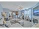 Open-concept living room featuring a fireplace, large sectional, and view of the kitchen at 1717 Brittlebush Ln, Johns Island, SC 29455