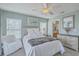 Well-lit bedroom with a ceiling fan, decorative wall art, and cozy furnishings at 1717 Brittlebush Ln, Johns Island, SC 29455