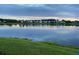 Beautiful community pond reflecting the skyline and the green surroundings at 1717 Brittlebush Ln, Johns Island, SC 29455
