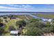 Stunning aerial view of coastal property with mature trees and scenic marsh views at 185 Wappoo Rd, Charleston, SC 29407
