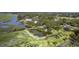 A stunning aerial view shows the property's pond, lush greenery, dock, and the serene waterway at 185 Wappoo Rd, Charleston, SC 29407