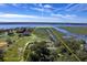 Aerial view highlighting property lines of coastal property with mature trees and marsh views at 185 Wappoo Rd, Charleston, SC 29407