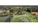 An aerial shot showcases a picturesque pond and lush greenery surrounding the home, creating a serene retreat at 185 Wappoo Rd, Charleston, SC 29407