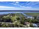 Aerial view of waterfront property highlighting approximate boundaries, lush landscape, and stunning water views at 185 Wappoo Rd, Charleston, SC 29407