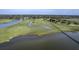 Amazing aerial view of property featuring a private pier and lush marshland with serene waterfront access at 185 Wappoo Rd, Charleston, SC 29407