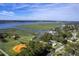 Expansive aerial view of waterfront property featuring lush landscape, serene water views, and mature trees surrounding area at 185 Wappoo Rd, Charleston, SC 29407