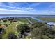 Picturesque aerial view of waterfront property with lush green landscape, and stunning water views on a bright day at 185 Wappoo Rd, Charleston, SC 29407