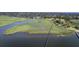 Scenic aerial view showcasing a waterfront property with a long pier and beautiful marshland surroundings at 185 Wappoo Rd, Charleston, SC 29407