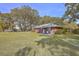 Inviting backyard featuring a well-kept lawn and mature trees, perfect for outdoor enjoyment at 185 Wappoo Rd, Charleston, SC 29407