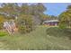 Backyard with a charming outdoor deck and stairs, leading to a serene view of the surrounding nature at 185 Wappoo Rd, Charleston, SC 29407