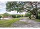 Expansive backyard with wooden deck and tire swing, perfect for outdoor enjoyment at 185 Wappoo Rd, Charleston, SC 29407