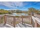 Scenic view from the wooden deck overlooking lush marshlands and serene waterways at 185 Wappoo Rd, Charleston, SC 29407