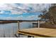 Dock view, showcasing a tranquil waterway with lush marshlands, evoking a sense of serenity at 185 Wappoo Rd, Charleston, SC 29407