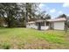 The backyard shows a home with a porch and a long green lawn at 201 Hayden St St, Walterboro, SC 29488