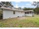 The backyard contains a white brick house with a red metal roof at 201 Hayden St St, Walterboro, SC 29488