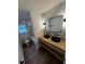 Elegant bathroom with dual black vessel sinks, wood vanity, and modern finishes at 201 Hayden St St, Walterboro, SC 29488