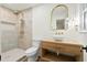 Modern bathroom featuring elegant lighting, updated fixtures, and a tiled shower at 201 Hayden St St, Walterboro, SC 29488