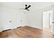 Bedroom featuring sleek ceiling fan, wood floors, and two closet doors at 201 Hayden St St, Walterboro, SC 29488