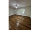 Bright living room featuring vinyl flooring, a ceiling fan, and natural light at 201 Hayden St St, Walterboro, SC 29488