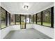 Cozy screened porch with view of backyard and mature trees at 201 Hayden St St, Walterboro, SC 29488