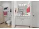 Clean, well-lit bathroom with white cabinets, and a tile floor at 2244 Ashley Crossing Dr # 426, Charleston, SC 29414
