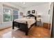 Cozy bedroom with lots of natural light, hardwood floors and a decorative mirror at 2244 Ashley Crossing Dr # 426, Charleston, SC 29414