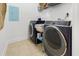 Laundry room equipped with modern, dark blue front loading washer and dryer units at 2244 Ashley Crossing Dr # 426, Charleston, SC 29414