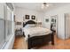 Comfortable main bedroom with a ceiling fan, wood flooring, and a large bed at 2244 Ashley Crossing Dr # 426, Charleston, SC 29414