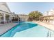 Spacious community pool area with plenty of seating and a covered pavilion at 2244 Ashley Crossing Dr # 426, Charleston, SC 29414