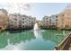 Beautiful community water fountain with lush landscaping, and apartment buildings in the background at 2244 Ashley Crossing Dr # 426, Charleston, SC 29414