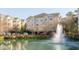 Community water fountain, apartment buildings, landscaping, and a view of the neighborhood at 2244 Ashley Crossing Dr # 426, Charleston, SC 29414