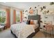Charming bedroom featuring colorful decor, including a patterned wall and pink curtains, for a vibrant and playful space at 2280 Minfarm Way # 529, Mount Pleasant, SC 29466