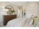 Serene bedroom featuring a dresser and closet doors, exuding comfort and style at 2280 Minfarm Way # 529, Mount Pleasant, SC 29466
