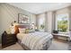 Cozy bedroom with a patterned accent wall, lots of natural light, and stylish decor at 2280 Minfarm Way # 529, Mount Pleasant, SC 29466