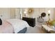 Inviting bedroom with dresser, sunburst mirror, and chic decor, creating a warm and stylish space at 2280 Minfarm Way # 529, Mount Pleasant, SC 29466