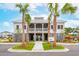 Community clubhouse with open-air social space, a second-story covered porch, and palm tree landscaping at 2280 Minfarm Way # 529, Mount Pleasant, SC 29466