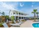 Poolside lounge chairs overlook the community pool and clubhouse in this active neighborhood at 2280 Minfarm Way # 529, Mount Pleasant, SC 29466