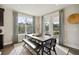 Inviting dining area with natural light, featuring an elegant table setting and access to the outdoor seating area at 2280 Minfarm Way # 529, Mount Pleasant, SC 29466