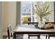 Cozy dining space with a modern table, seating for four, and a view of the outdoor patio through sliding glass doors at 2280 Minfarm Way # 529, Mount Pleasant, SC 29466