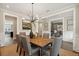 Sophisticated dining room with modern chandelier, wood table, and stylish decor at 2280 Minfarm Way # 529, Mount Pleasant, SC 29466