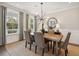 Elegant dining room features a modern light fixture, neutral decor, and window views at 2280 Minfarm Way # 529, Mount Pleasant, SC 29466