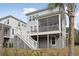 Exterior back elevation with steps to an elevated, screened porch at 2280 Minfarm Way # 529, Mount Pleasant, SC 29466