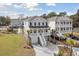 Picturesque beach home with a covered porch, lush landscaping, and serene water views of the nearby fountain at 2280 Minfarm Way # 529, Mount Pleasant, SC 29466