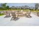 Outdoor fire pit surrounded by Adirondack chairs creates a cozy community gathering space at 2280 Minfarm Way # 529, Mount Pleasant, SC 29466