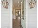A bright and stylish foyer welcomes you with hardwood floors and a view into a modern living space at 2280 Minfarm Way # 529, Mount Pleasant, SC 29466