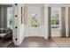 Bright and inviting foyer with hardwood floors, stylish wainscoting, and an abundance of natural light at 2280 Minfarm Way # 529, Mount Pleasant, SC 29466